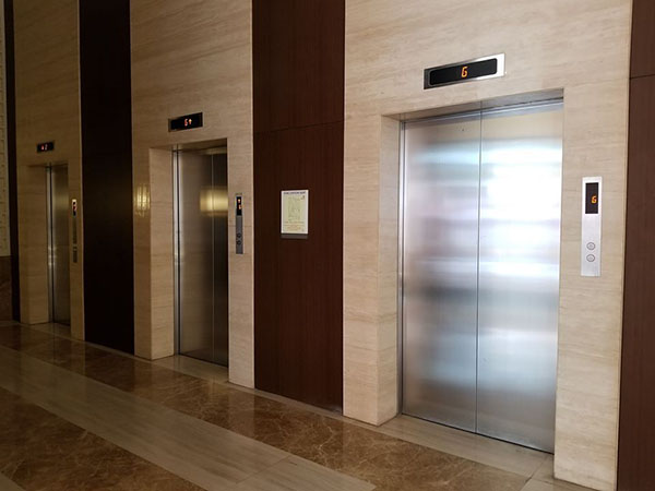 the 3 fast elevators of the condo