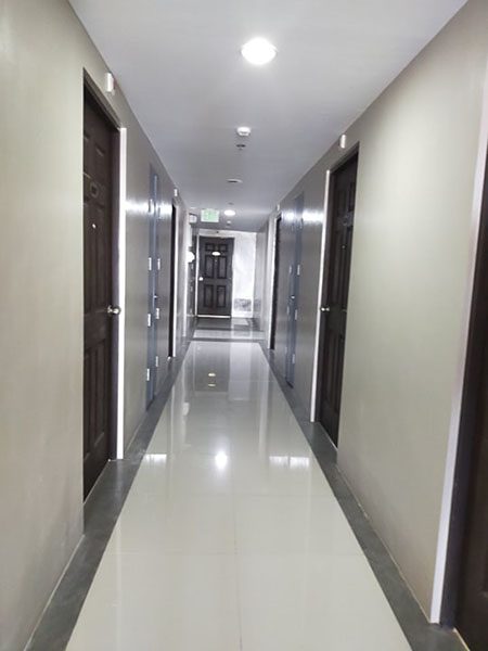 well-lighted hallway of the condominium